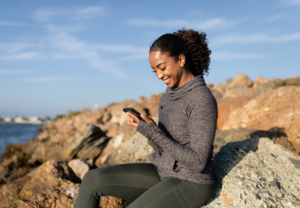 woman texting Life Coaching and Therapy